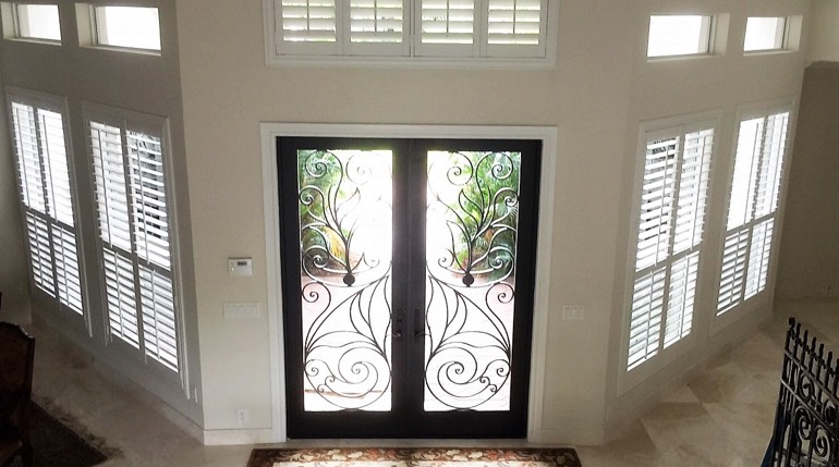 Destin foyer with glass doors and indoor shutters